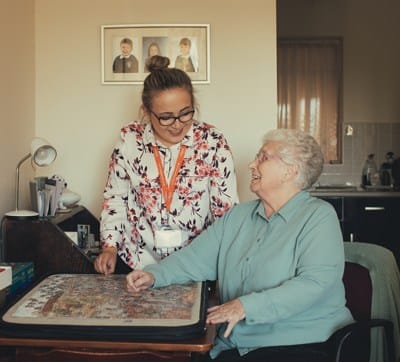 elderly woman and carer at home