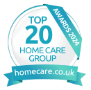 A circular badge reading “Top 20 Home Care Group – Awards 2024” with a ribbon showing “homecare.co.uk.”