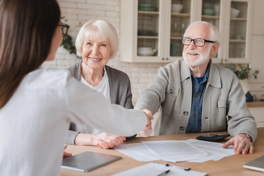 A care professional meeting with a family to discuss live-in care options