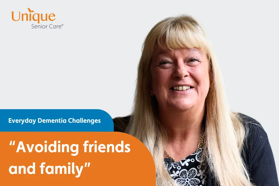 A smiling woman with long blonde hair sits in front of a graphic titled “Everyday Dementia Challenges – Avoiding friends and family.”