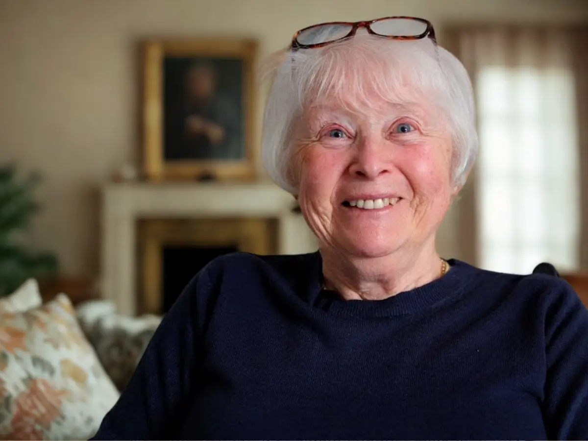 Carol MacKinnon, unique senior care client, smiling at the camera