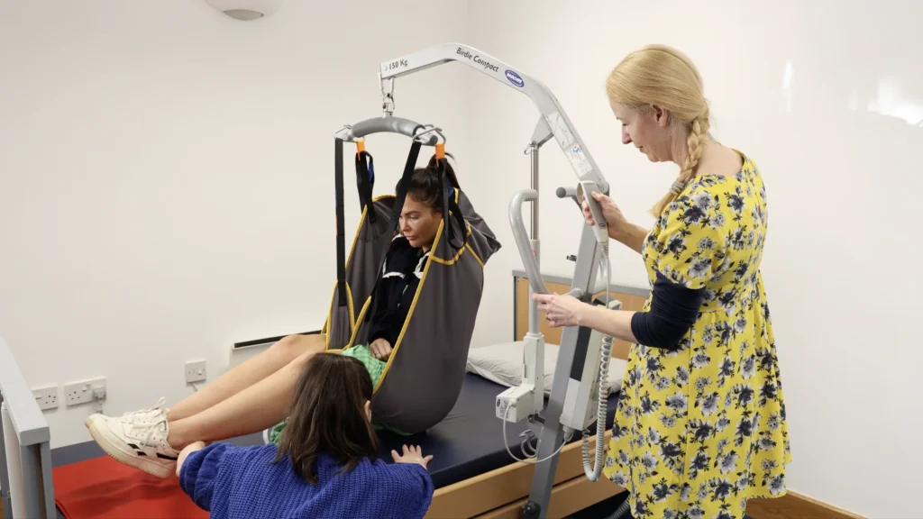 Our L&D manager, Jo, and trainer, Hannah, demonstrating safe practices using a hoist