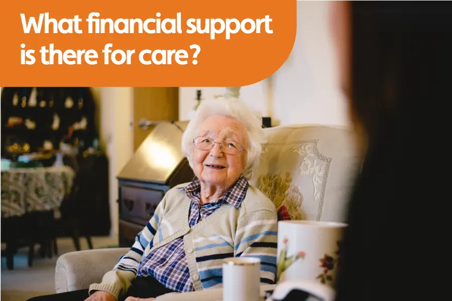 Thumbnail image forr blog on funding support for care. Image shows a smiling elderly woman sitting in a cosy living room with a visitor, representing support and comfort in later life.
