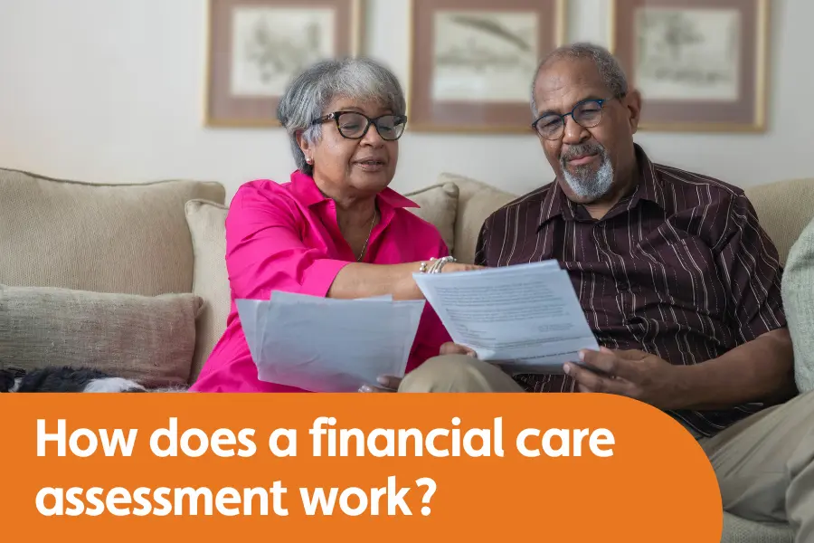 featured image for blog titled how does a financial assessment for care work, featuring couple sat on a sofa looking at paperwork