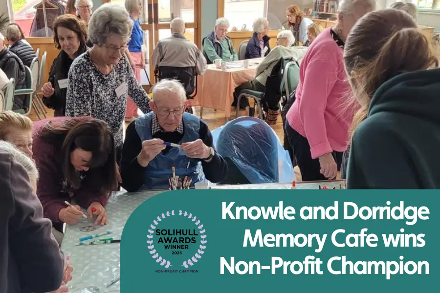 Fetured image for blog about Knowle and Dorridge Memory cafes award win. Photo shows attendees enjoying crafts at the memory cafe