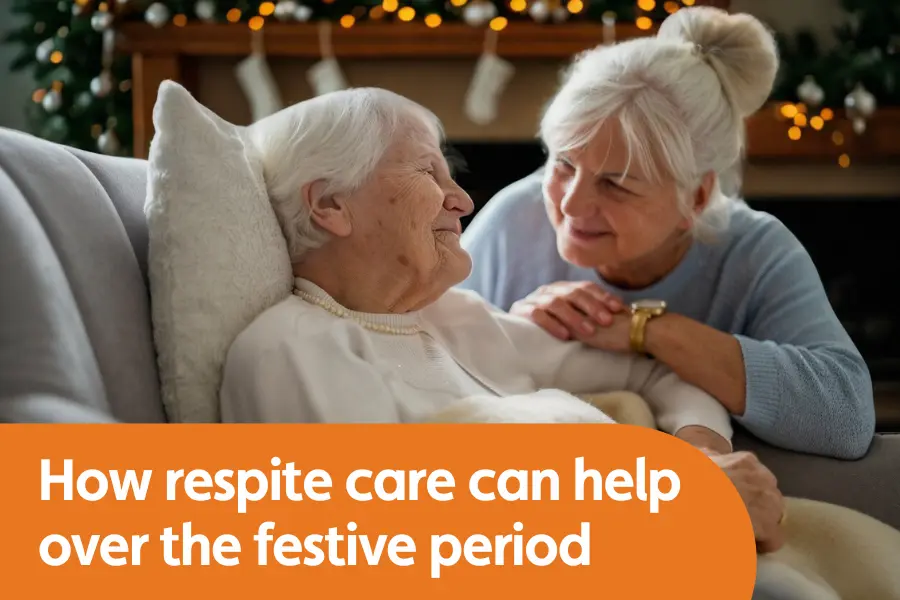 featured image for blog on respite care over festive period. image shows older lady and younger woman looking at each other smiling with christmas decorations in the background
