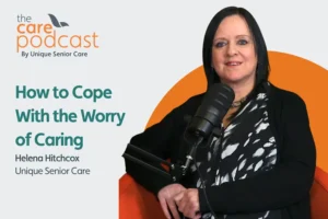 Featured image for podcast on how to deal with the worry of caring. Image shows Helena Hitchcox sat in the podcast studio with a microphone in front of her