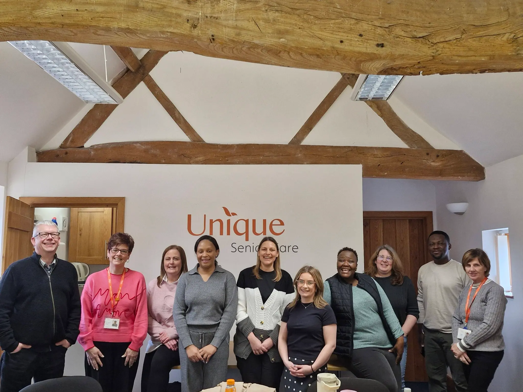 a group of amnagers during leadership training at unique Senior Care