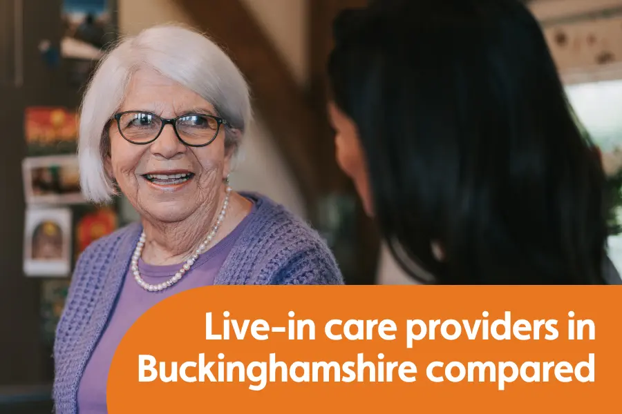 Featured image for blog comparing live-in care providers in Buckinghamshire. Image shows a woman smiling which looking at another lady who has her back to the camera