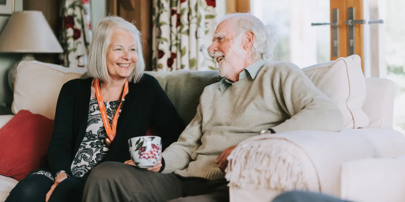 A Unique Senior Care Caregiver and client sharing a moment at home